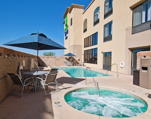 A hotel pool area with lounge chairs, a hot tub, and a clear blue sky. - Holiday Inn Express & Suites Oro Valley-Tucson North by IHG (Oro Valley)