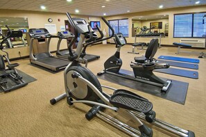 A hotel fitness center with various cardio machines, free weights, and exercise mats. - Holiday Inn Express & Suites Oro Valley-Tucson North by IHG (Oro Valley)