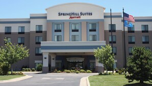 A hotel with a large sign reading "Springhill Suites Marriott" and an American flag. - Springhill Suites by Marriott Oklahoma City Airport (Oklahoma City)