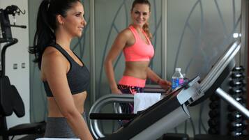 A gym with treadmills and exercise equipment.
