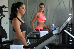 A gym with treadmills and exercise equipment.