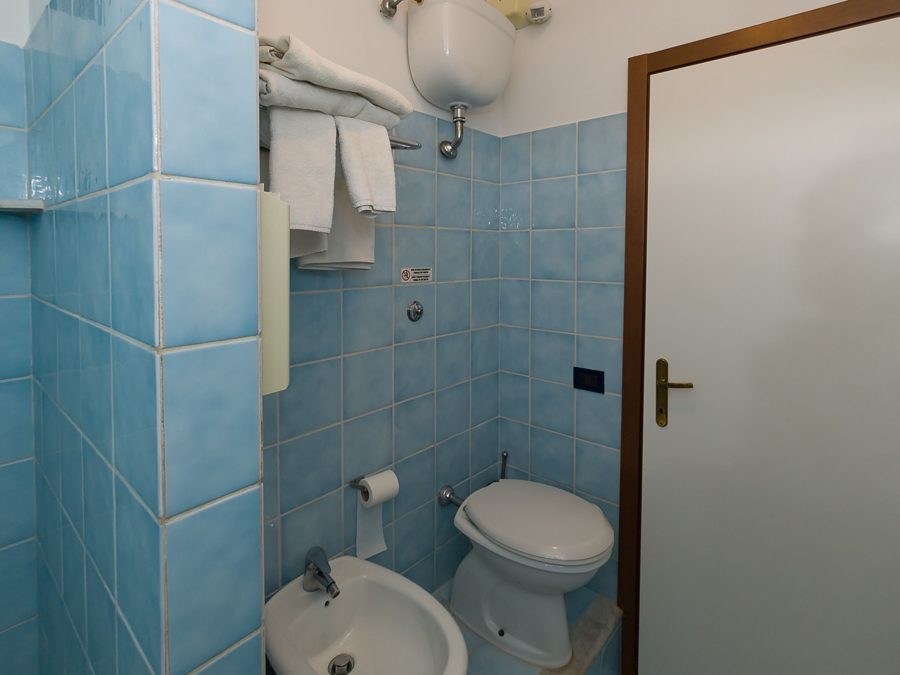 shower, rainfall showerhead, hair dryer, towels