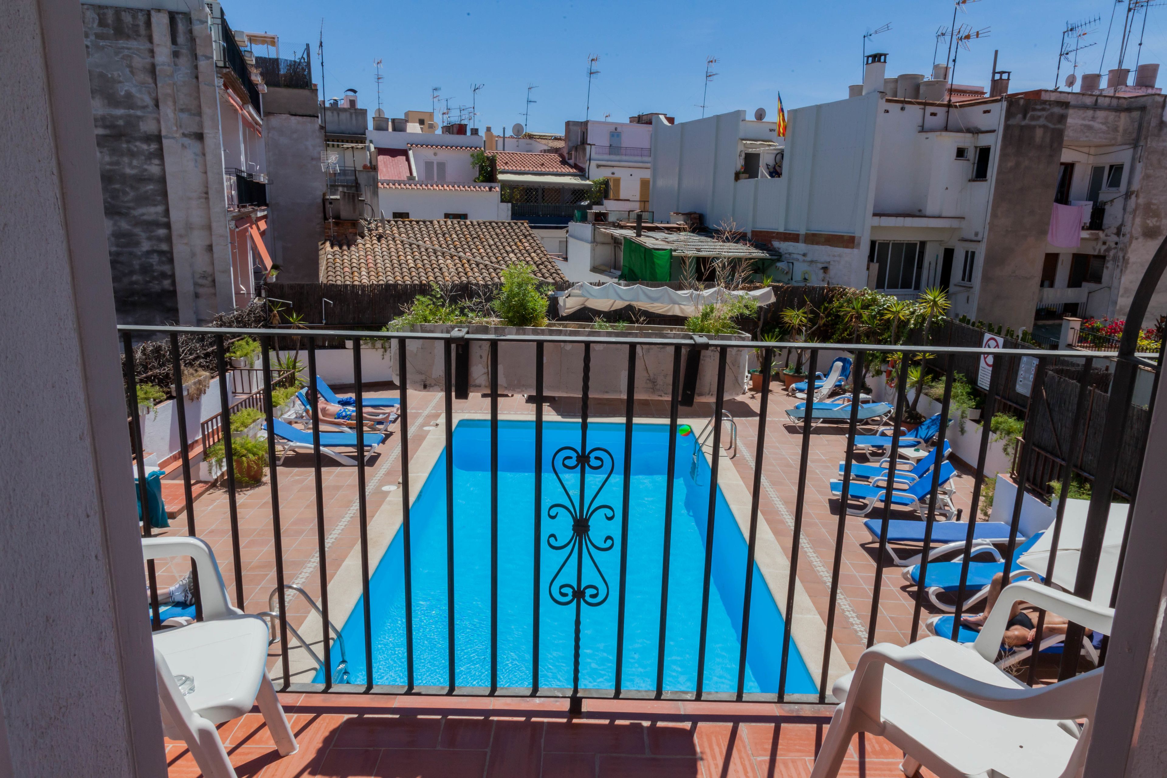 outdoor pool, pool umbrellas, pool loungers