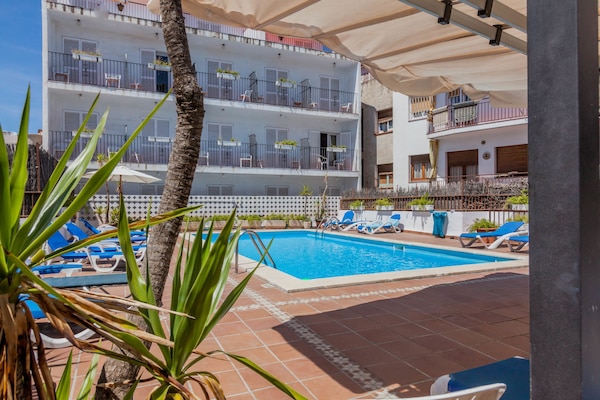 Outdoor pool, pool umbrellas, pool loungers