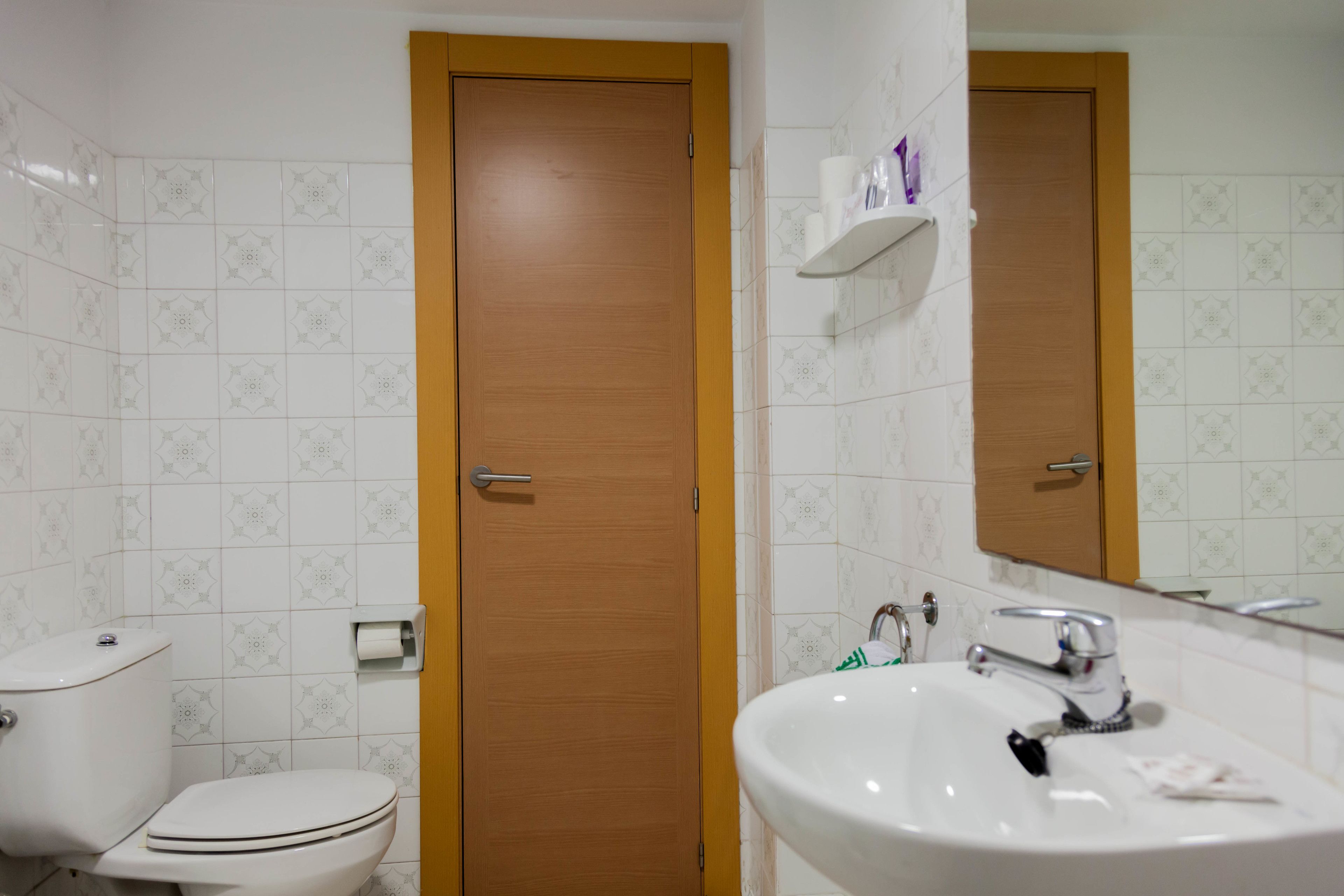 rainfall showerhead, towels, soap, shampoo