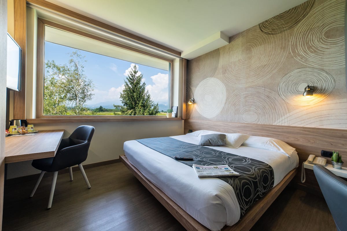 Suite Junior | 1 camera, biancheria da letto di alta qualità, copriletto in piuma