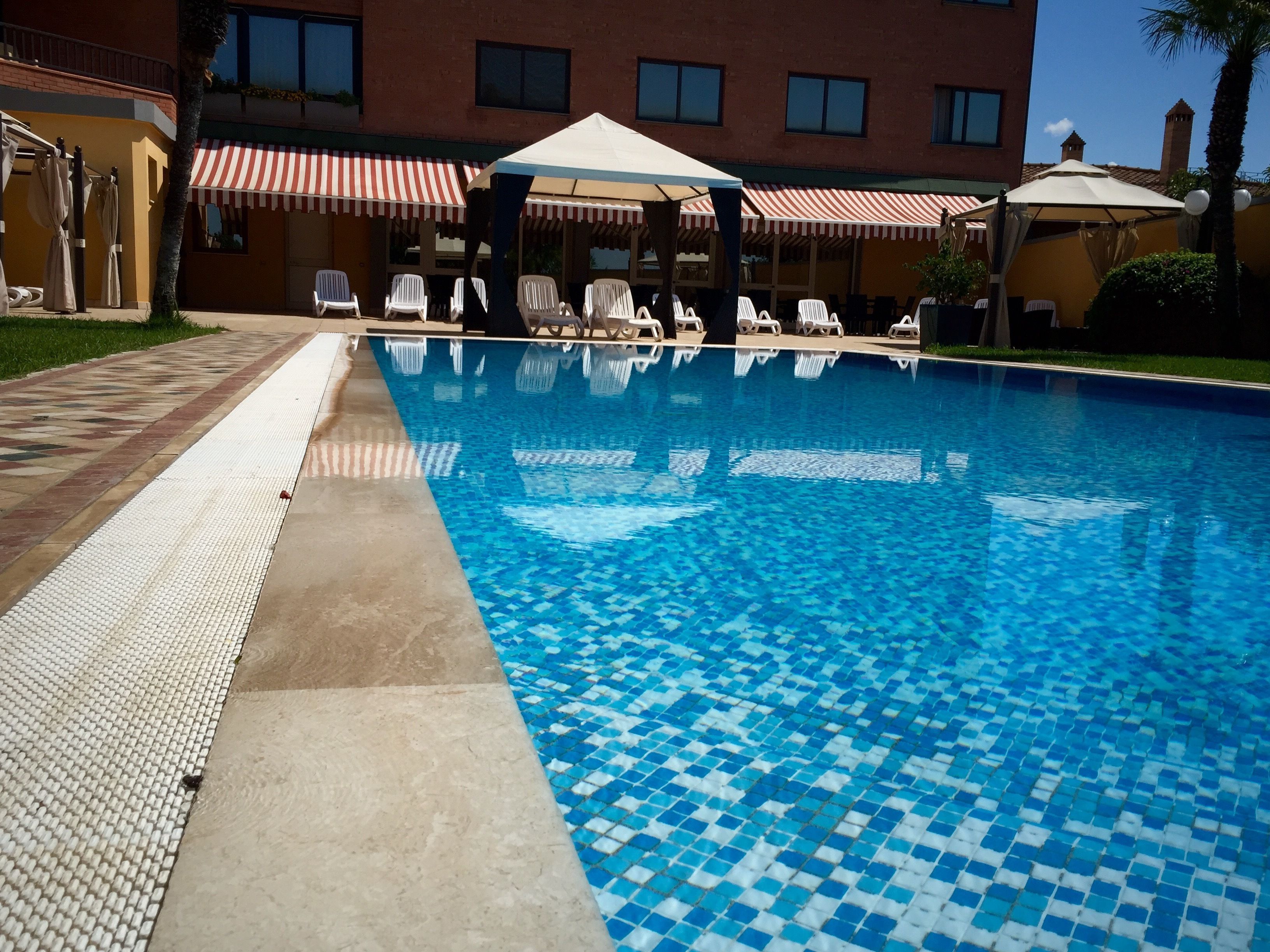 seasonal outdoor pool, pool umbrellas, pool loungers