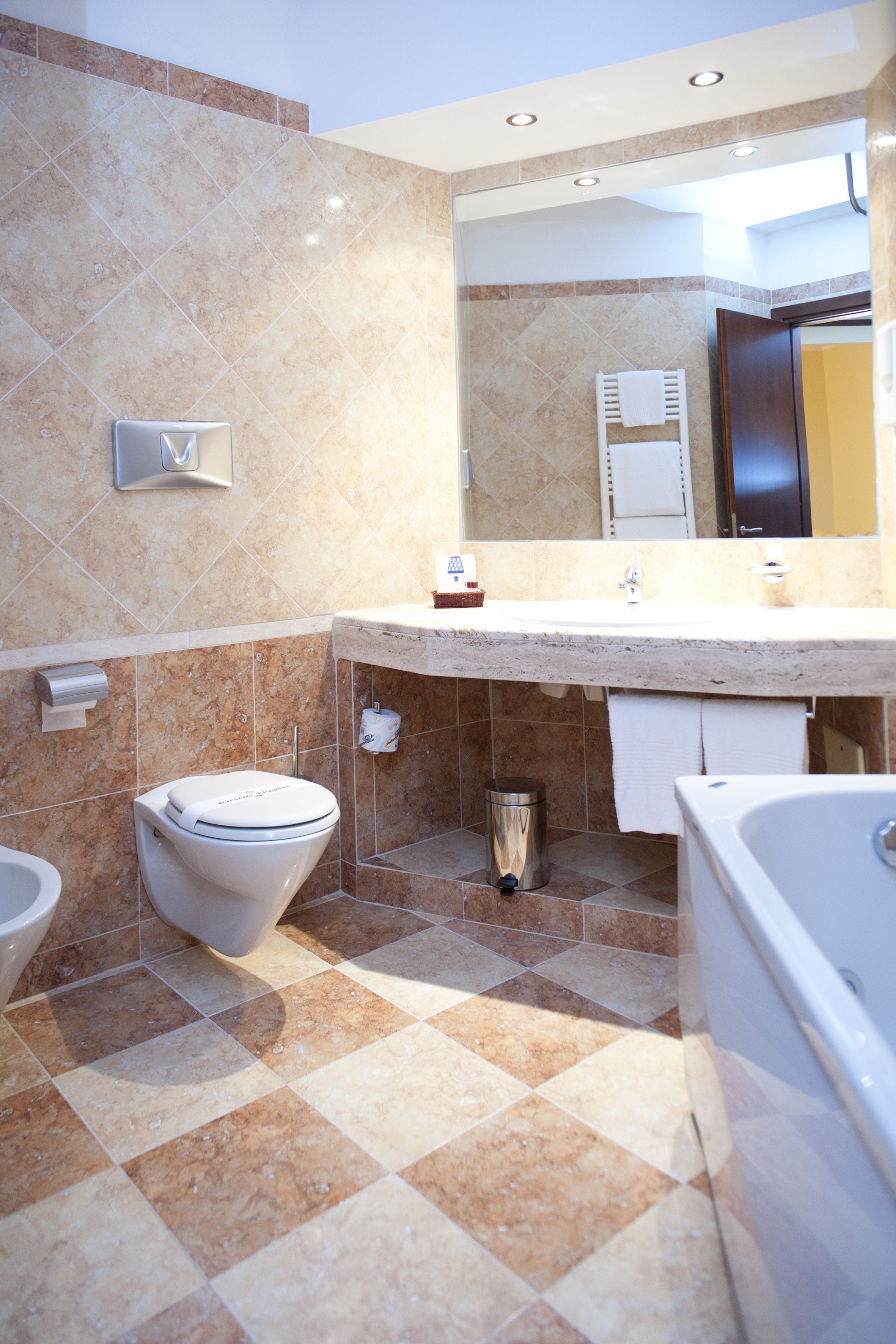 junior suite, balcony | bathroom | combined shower/bathtub, deep-soaking bathtub, rainfall showerhead