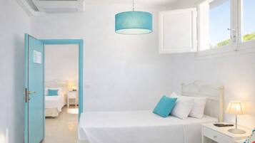 Basic Quadruple Room | Minibar, in-room safe, free WiFi, bed sheets