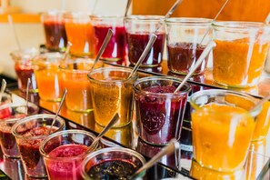 A variety of colorful beverages in glasses and jars, likely a selection of juices or smoothies. - Villa Marburg Im Park (Heigenbruecken)