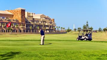 Enjoy a round of golf on our well-maintained course, with a putting green and golf cart available for use.