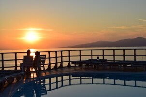 Seasonal outdoor pool, open 9:00 AM to 7:30 PM, sun loungers