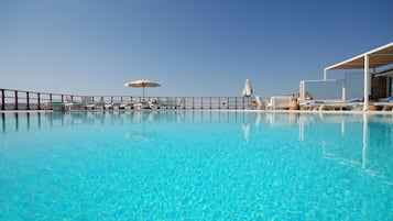 Seasonal outdoor pool, open 9:00 AM to 7:30 PM, pool loungers