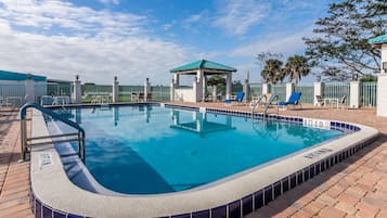 Outdoor pool, open 7:00 AM to 6:00 PM, pool loungers