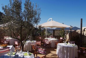 Breakfast, lunch, dinner served; local cuisine, alfresco dining