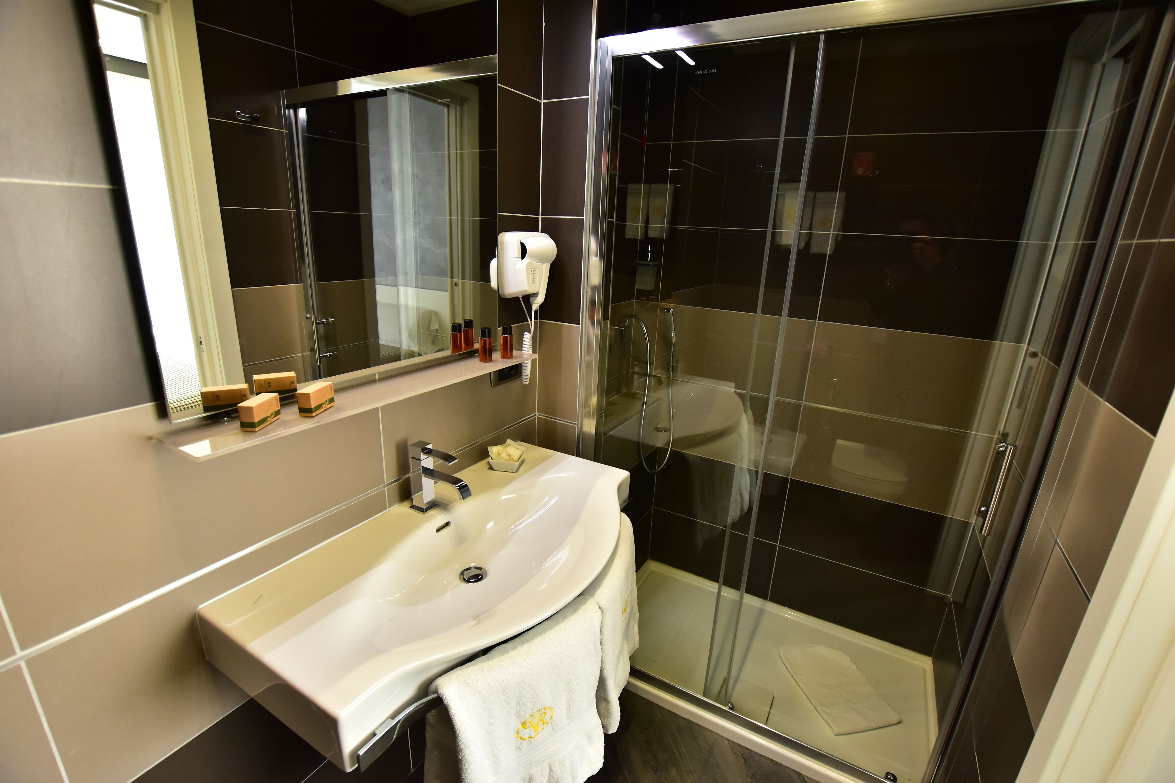 standard double or twin room | bathroom | combined shower/bathtub, designer toiletries, hair dryer, slippers
