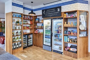 A well-stocked pantry with shelves of snacks, beverages, and condiments. - Staybridge Suites Liverpool by IHG (Liverpool)