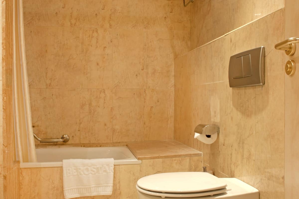 bathtub, eco-friendly toiletries, towels