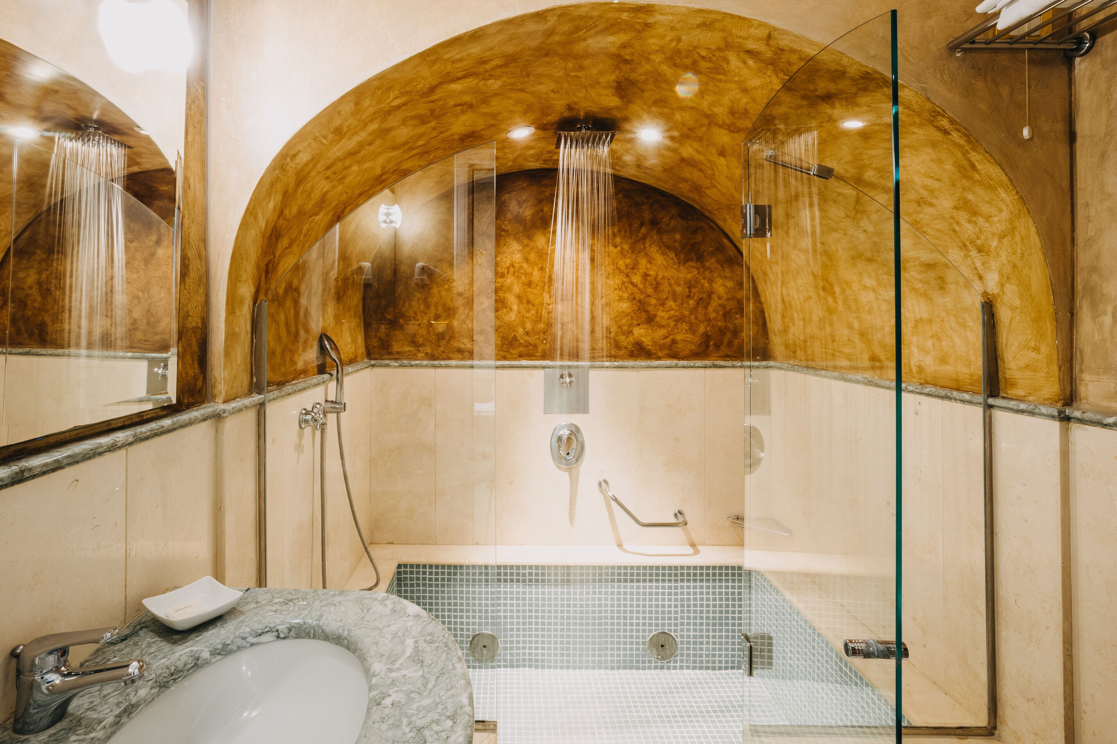 junior suite | bathroom | combined shower/bathtub, designer toiletries, hair dryer, slippers