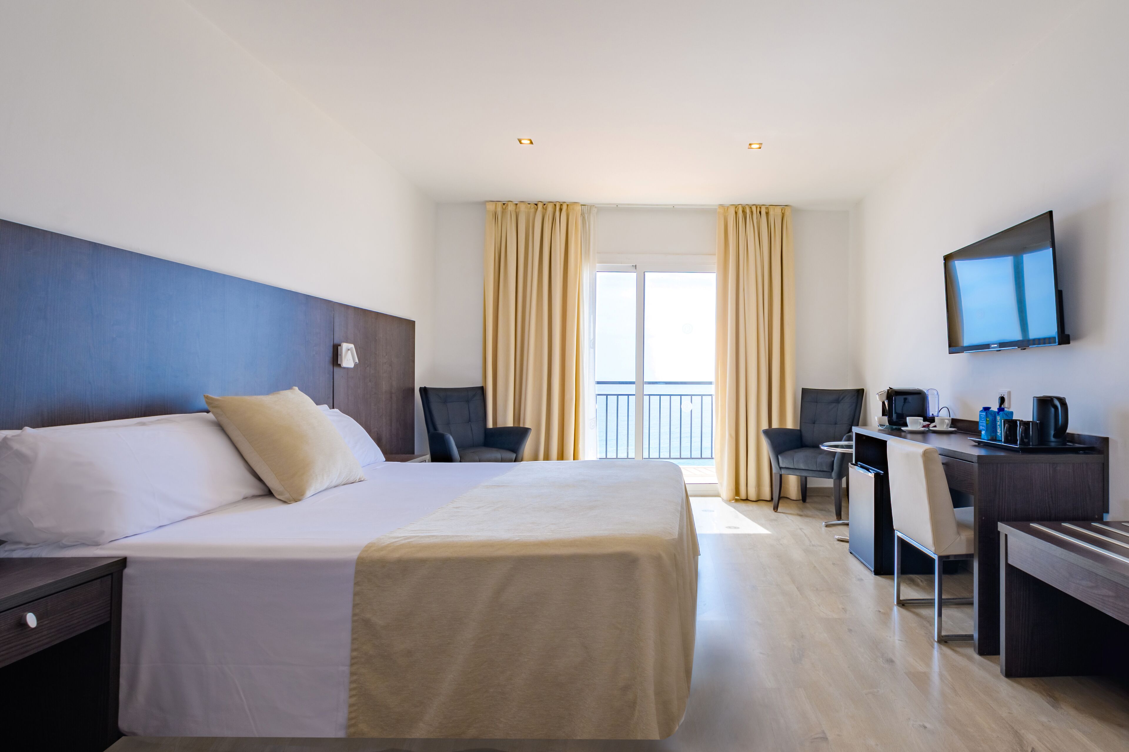 Superior Double Room, Balcony, Sea View | Minibar, in-room safe, desk, blackout drapes