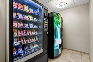 A vending machine with snacks and a digital display.