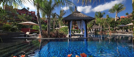 7 outdoor pools, open 11:00 AM to 7:00 PM, pool umbrellas, sun loungers