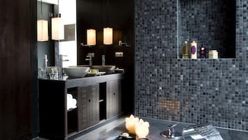 Separate bathtub and shower, free toiletries, hair dryer, slippers