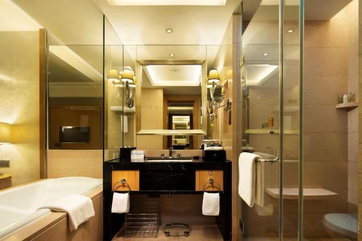 Separate tub and shower, rainfall showerhead, designer toiletries