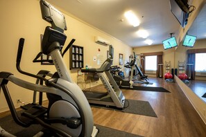 A gym with treadmills, elliptical machines, and exercise balls. - Holiday Inn Express & Suites Deer Park by IHG (Deer Park)