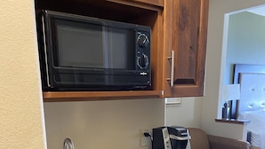 A compact kitchen with a microwave, sink, and coffee maker. - Holiday Inn Express & Suites Silt-Rifle by IHG (Silt)