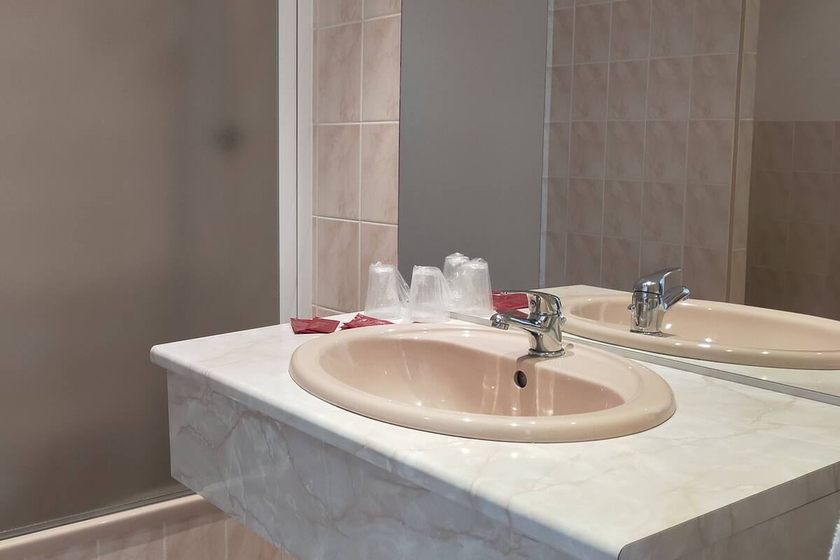 comfort room, refrigerator & microwave | bathroom sink