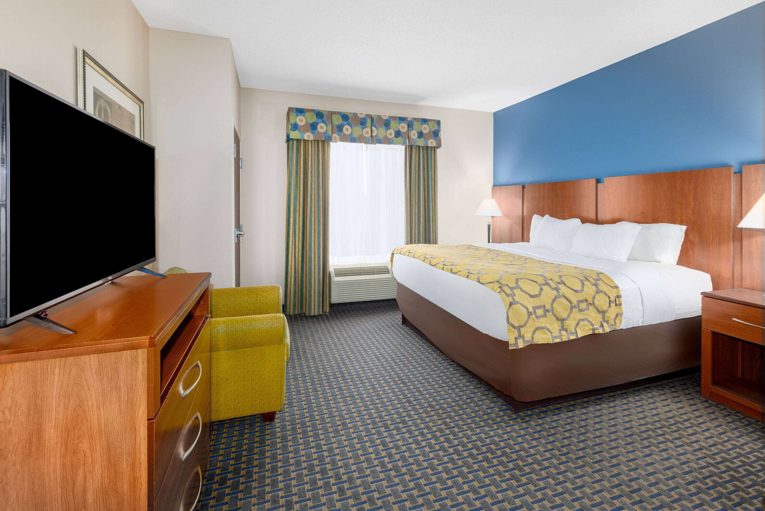 pillow-top beds, desk, laptop workspace, blackout curtains