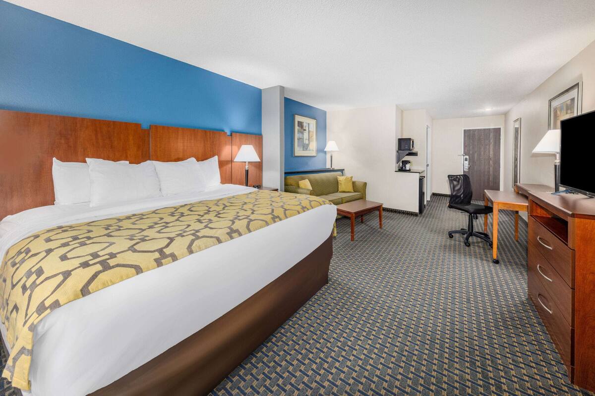 pillow-top beds, desk, laptop workspace, blackout curtains