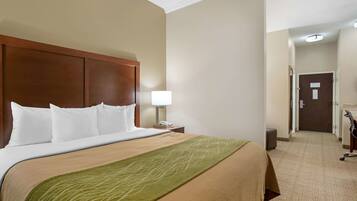 Premium bedding, desk, laptop workspace, blackout curtains