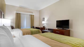 Premium bedding, desk, laptop workspace, blackout drapes