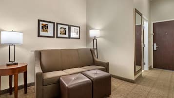 Premium bedding, desk, laptop workspace, blackout drapes