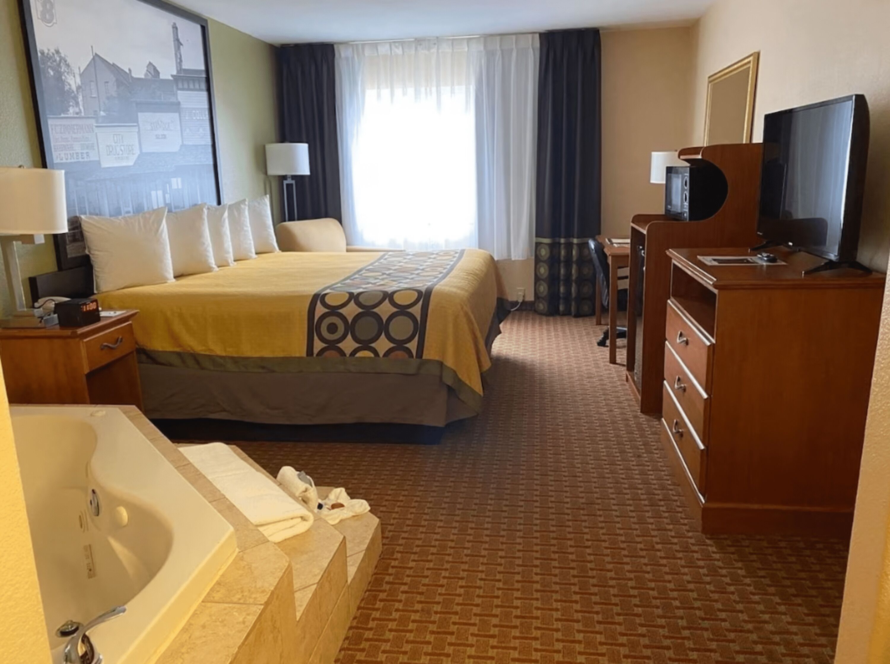 deluxe room, 1 king bed, non smoking | premium bedding, desk, laptop workspace, blackout curtains