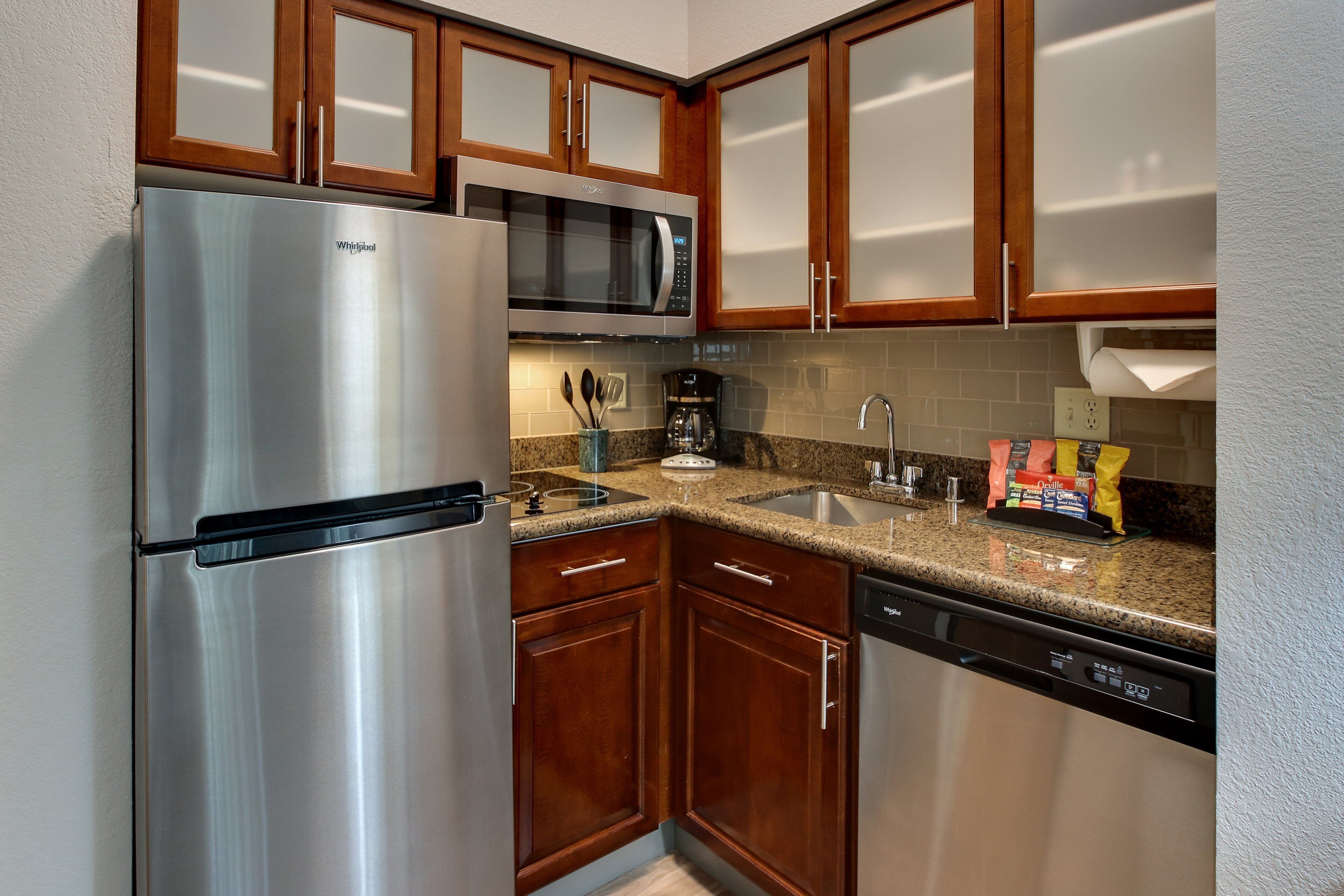 full-sized fridge, microwave, stovetop, dishwasher