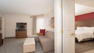 Desk, laptop workspace, blackout drapes, iron/ironing board