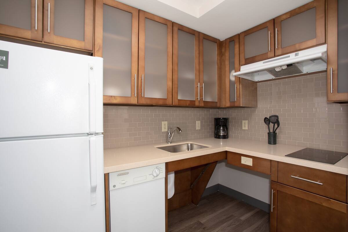 full-sized fridge, microwave, stovetop, dishwasher