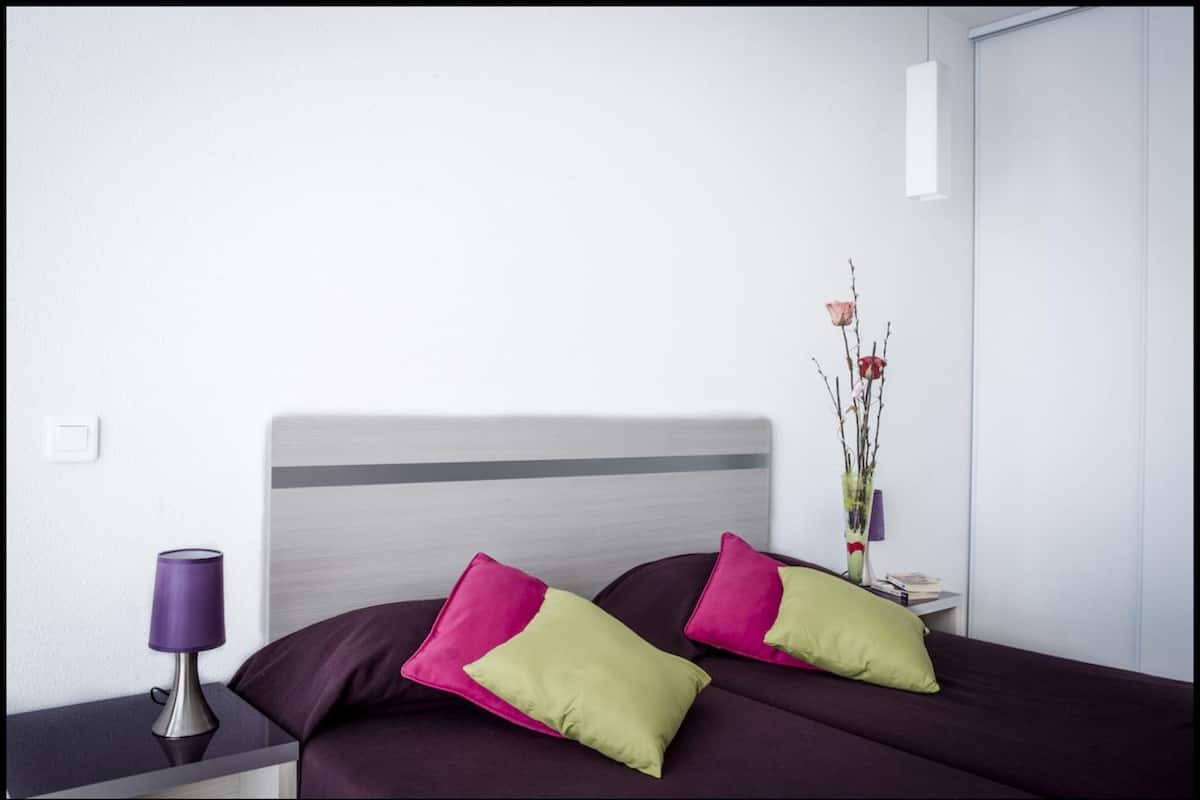 Blackout drapes, soundproofing, iron/ironing board