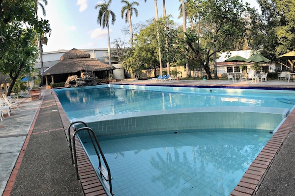 Outdoor pool, open 8:30 AM to 10:30 PM, pool umbrellas