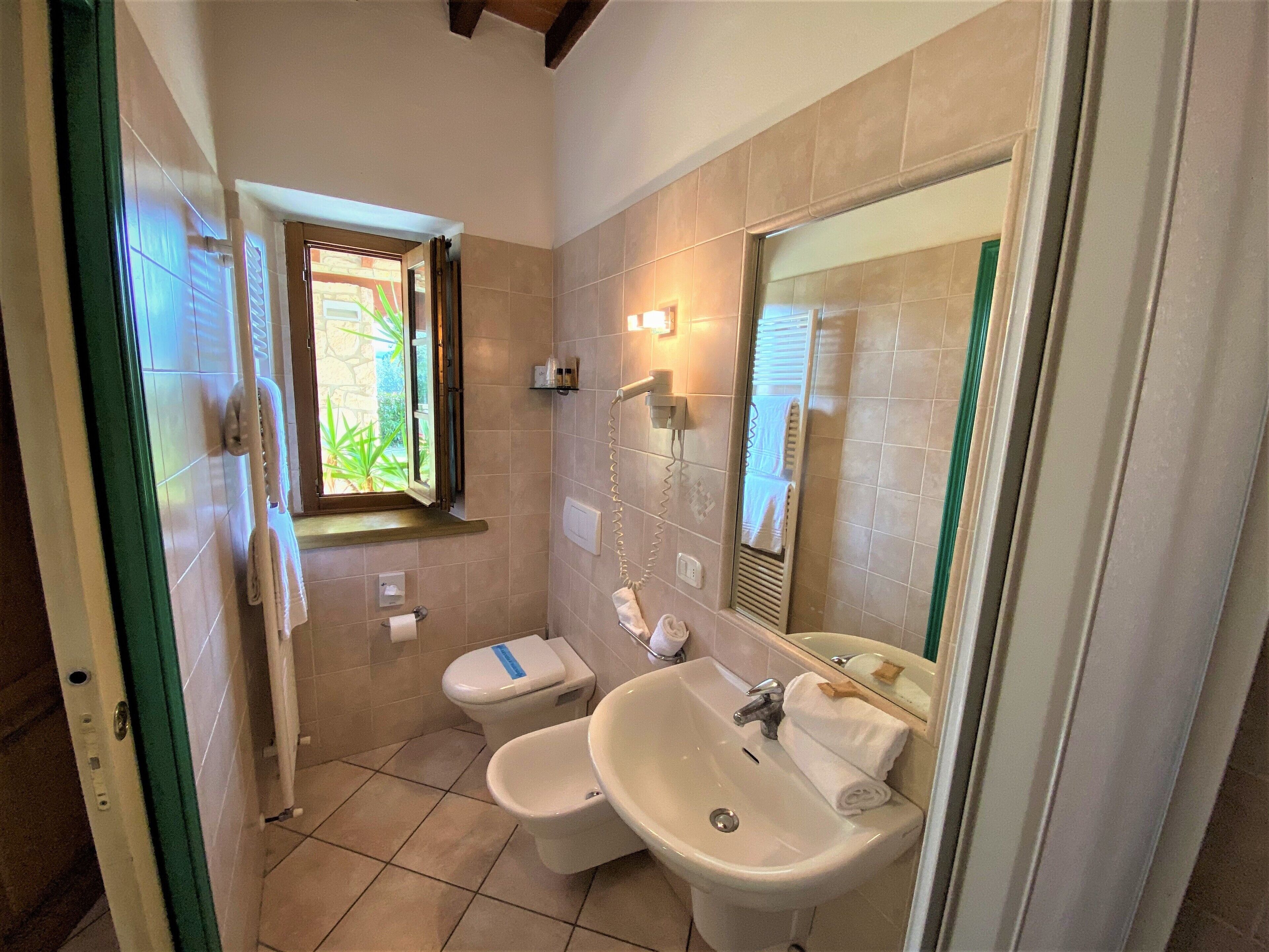 family room | bathroom | shower, hair dryer, towels