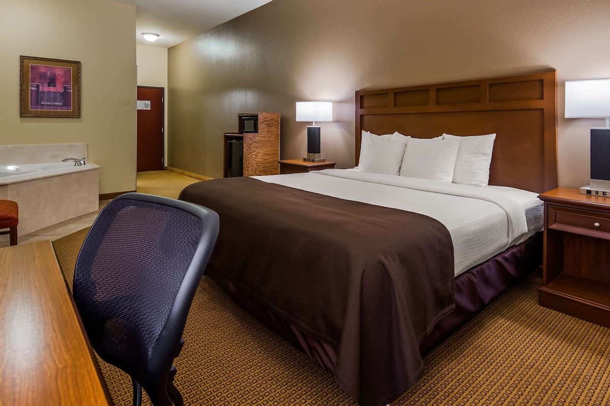 Suite, 1 King Bed, Non Smoking, Jetted Tub | Pillowtop beds, desk, iron/ironing board, free WiFi