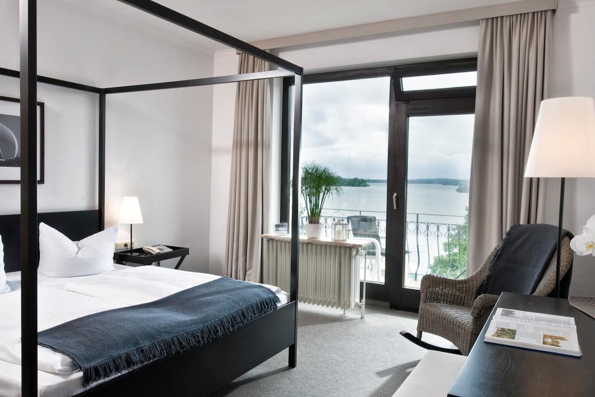standard double room - lake view balcony | in-room safe, desk, blackout curtains, iron/ironing board