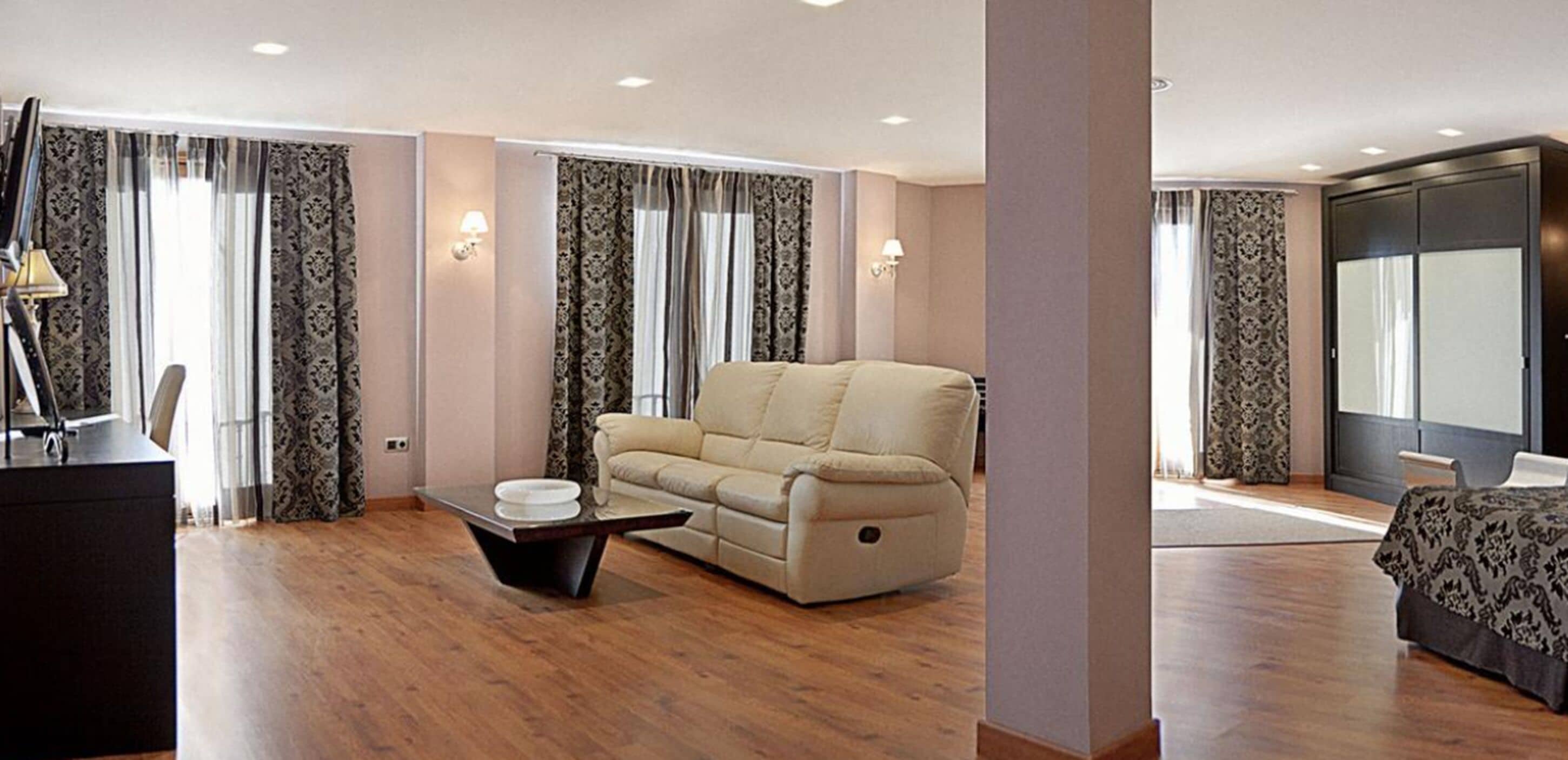 junior suite, hot tub | living room | flat-screen tv