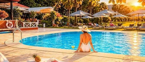 Outdoor pool, pool umbrellas, sun loungers