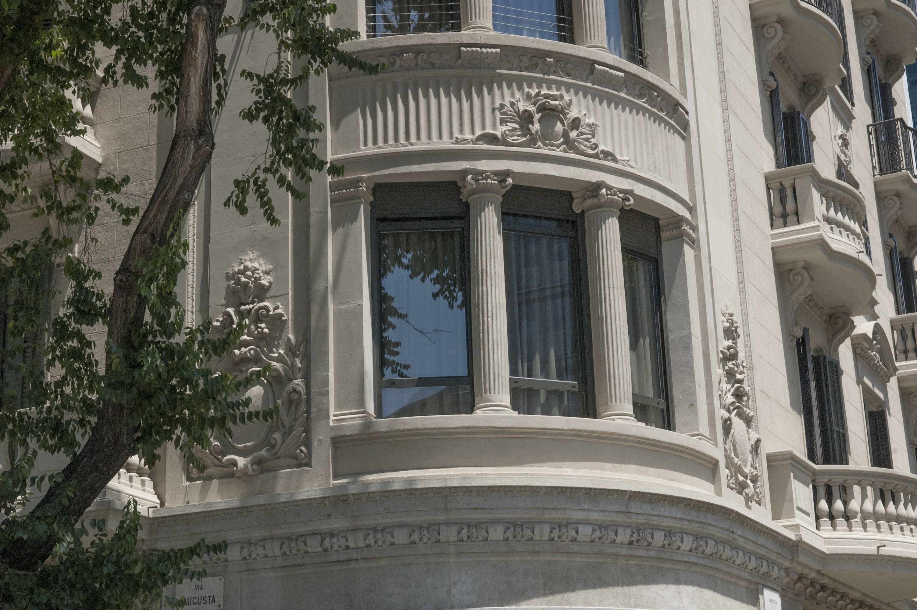 A building with ornate architectural details, including columns and decorative moldings.