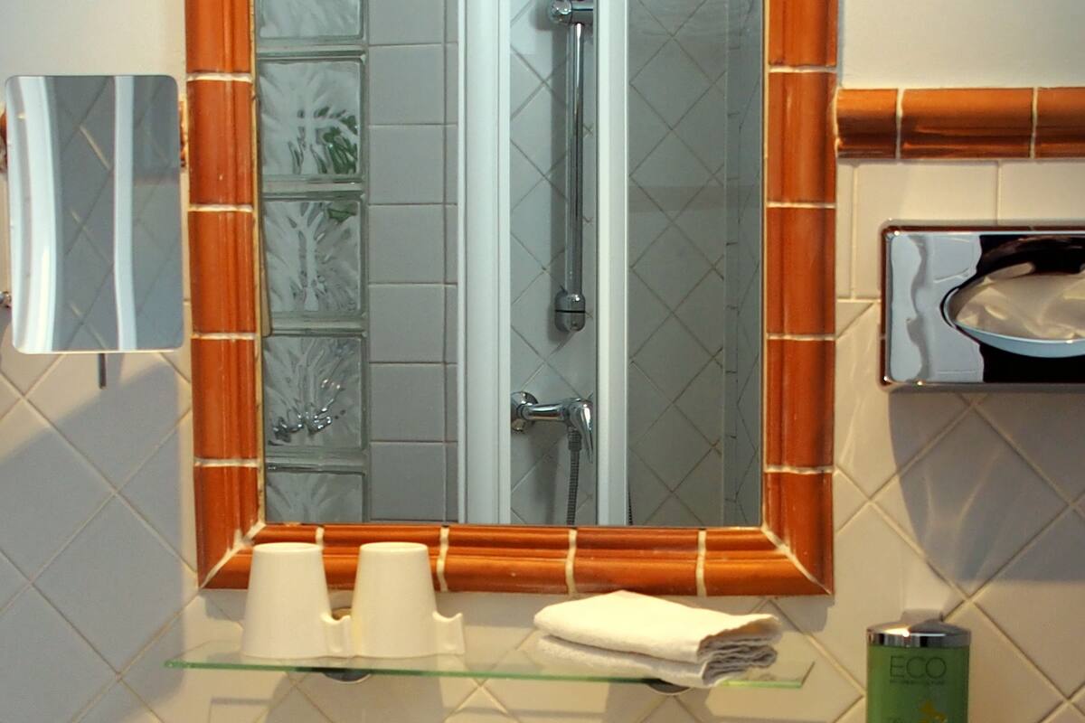 superior double room, garden area | bathroom | shower, free toiletries, hair dryer, towels