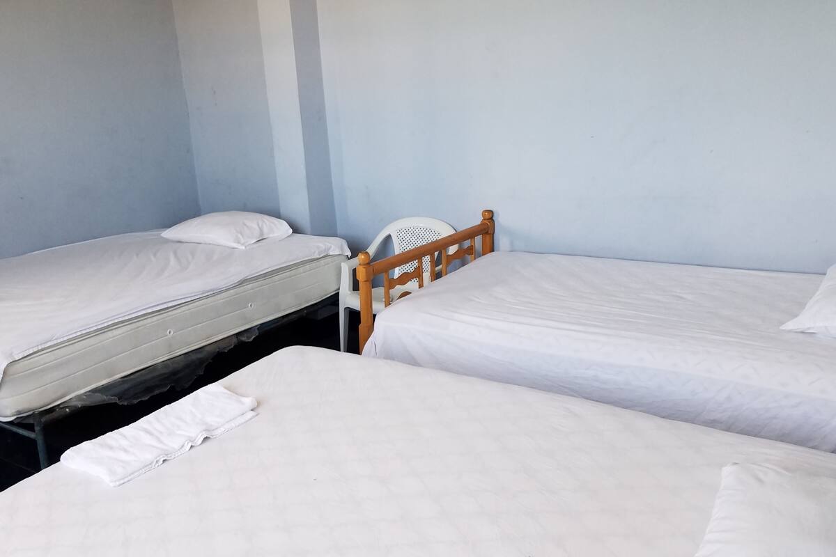 Basic Room, Multiple Beds, Private Bathroom, Beachfront | Desk, free WiFi